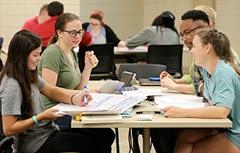 Students talking at table